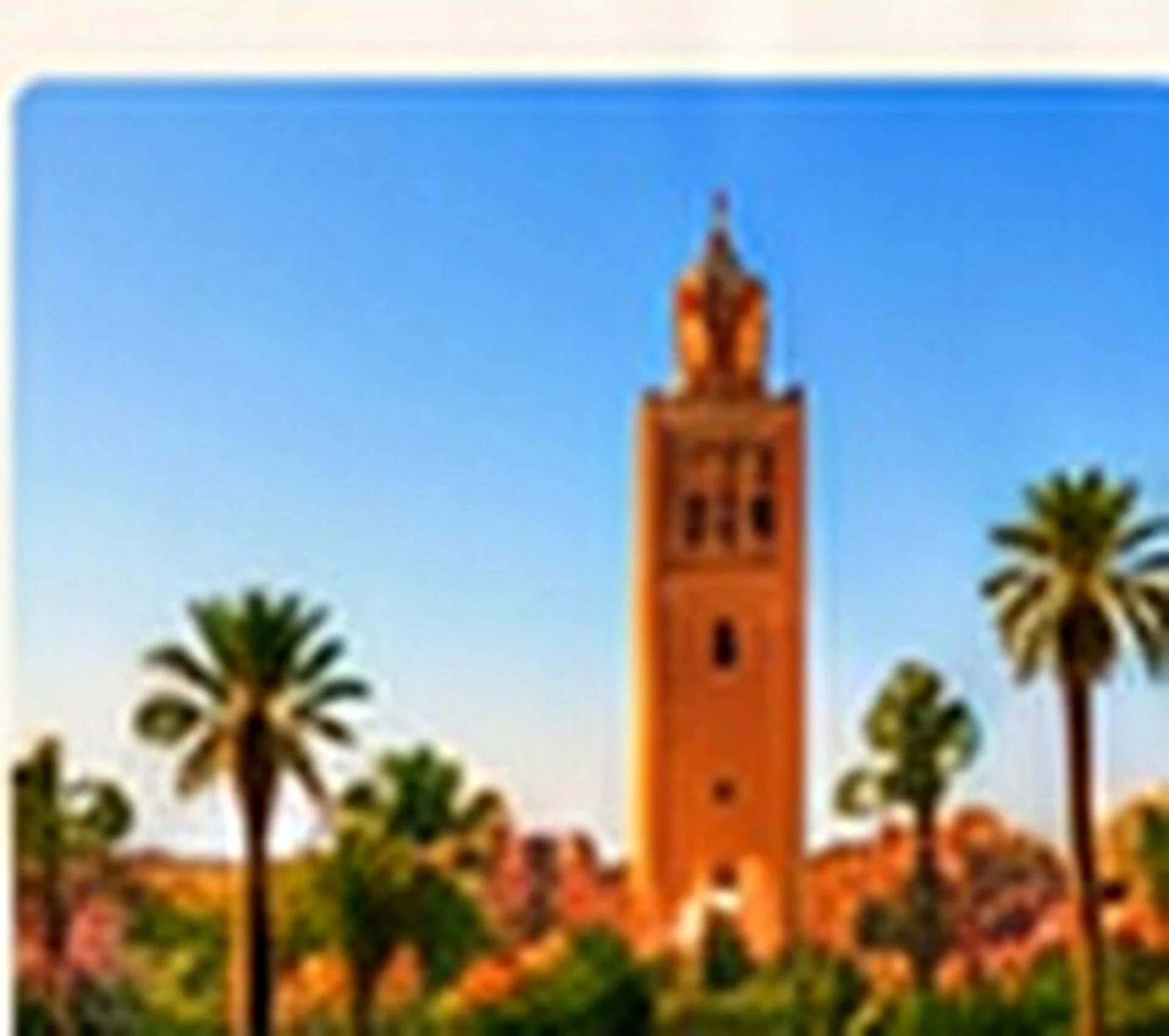 Marrakech skyline and Koutoubia with Atlas Mountains in Morocco