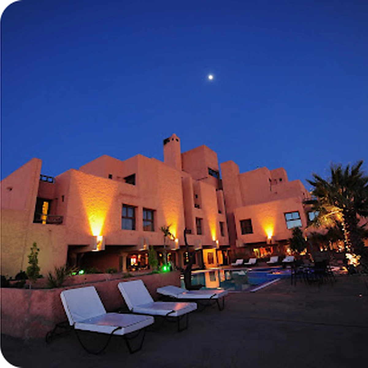 Curated Moroccan hotel at dusk