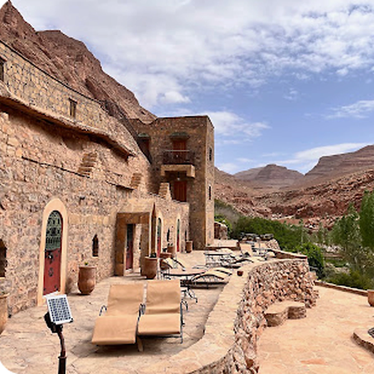 Curated stone lodge in a dramatic valley